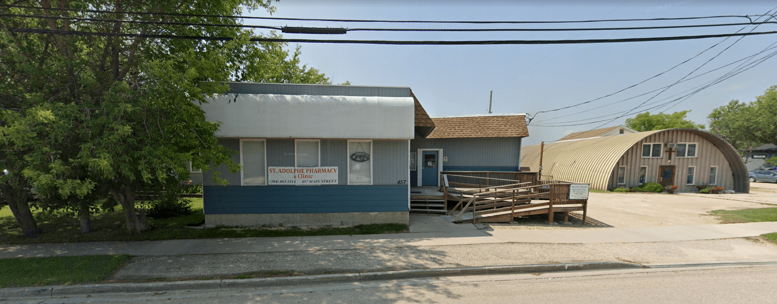 Interior of St. Adolphe Pharmacy with shelves of health products